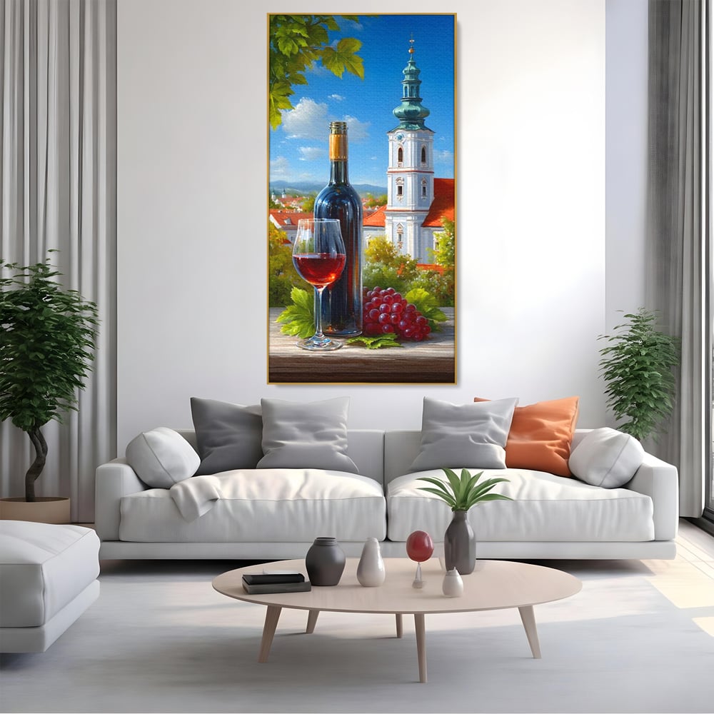 Tablou canvas cu pictura cu sticla de vin si manastire, in rama de aluminiu auriu, pe perete intr-un living